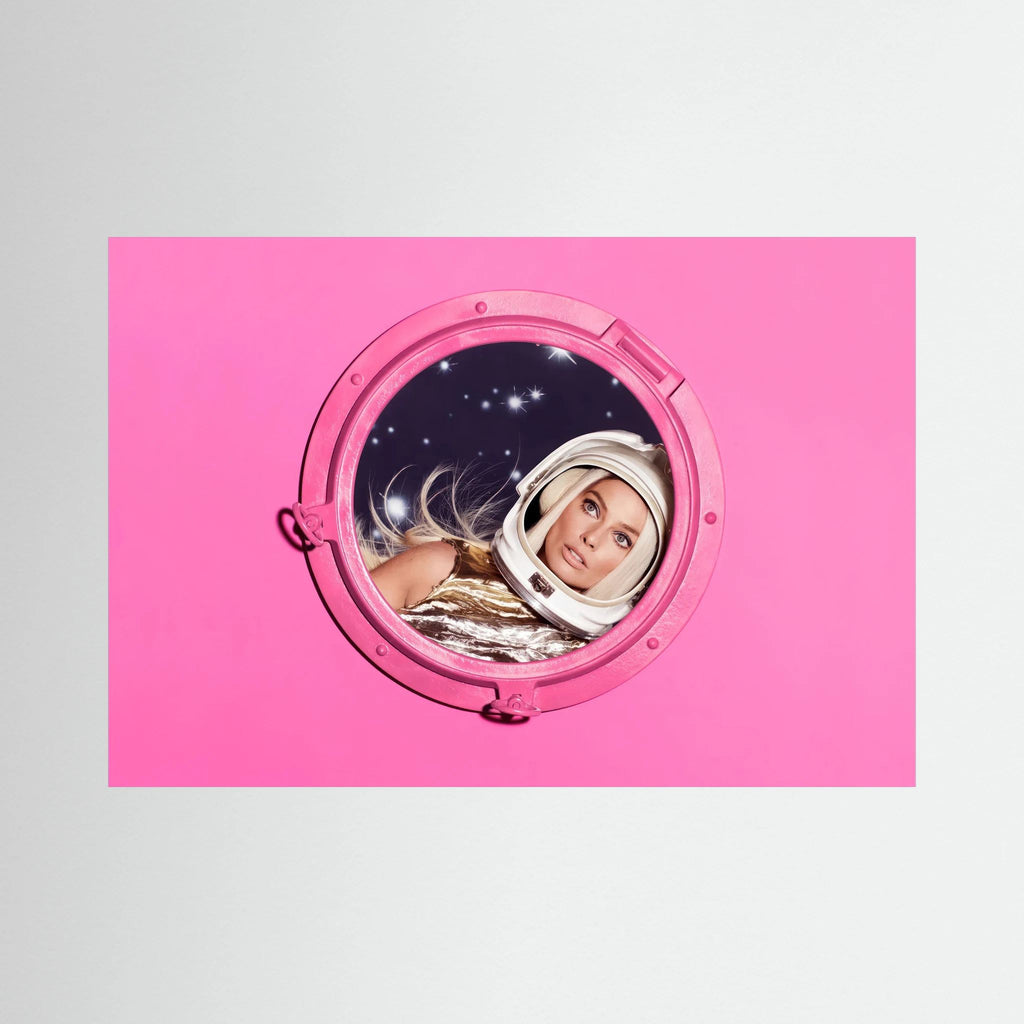 Woman in a metallic astronaut suit looks through a circular porthole set in a vivid pink field, shown in product view 4.