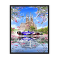 Formula One car before Barcelona's Sagrada Família with pink blossom and mirrored water.