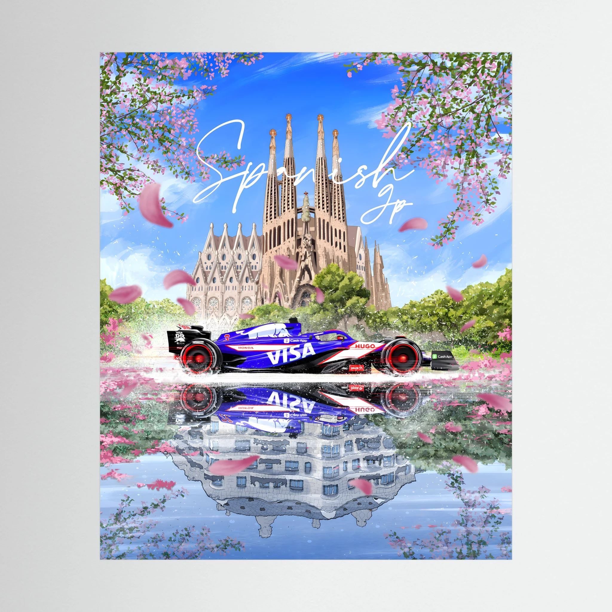 Formula One car before Barcelona's Sagrada Família with pink blossom and mirrored water.