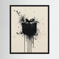 Black gift box with ribbon surrounded by expressive paint splashes on a cream background, shown in product view 4.
