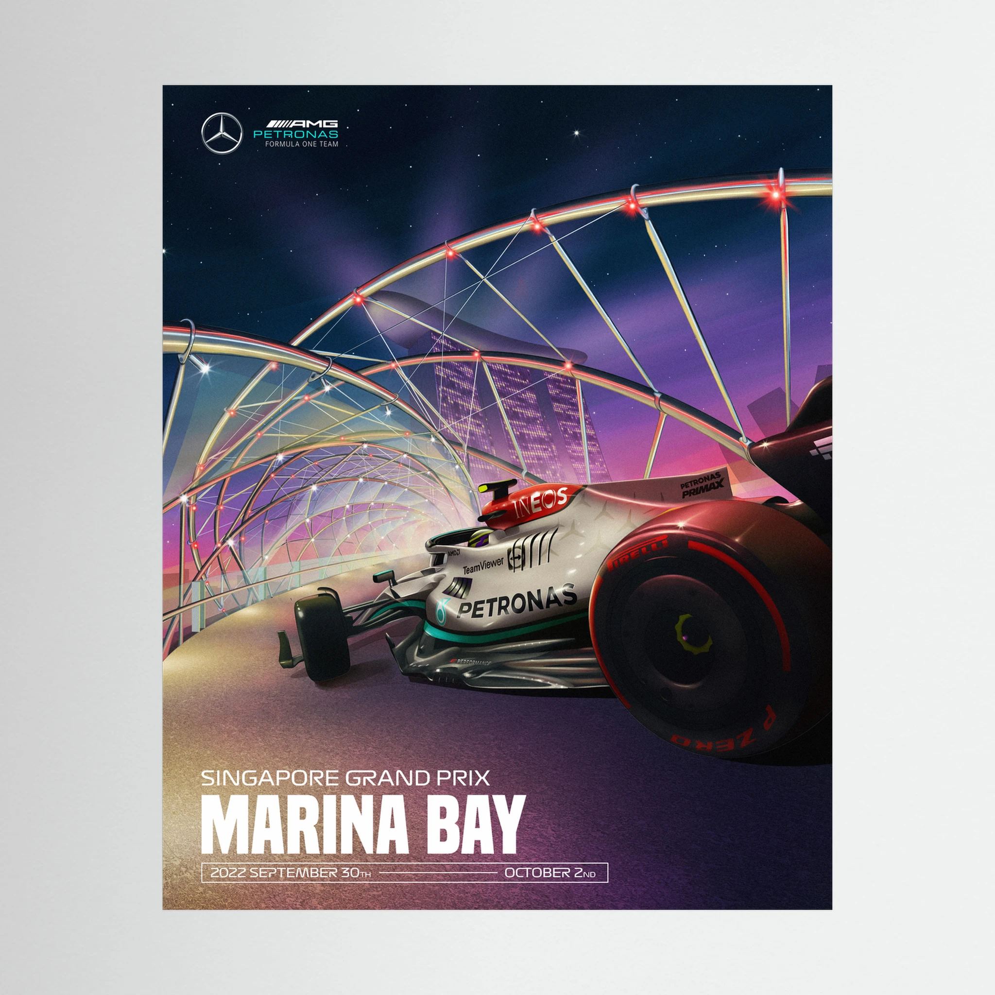 Mercedes Formula One car beneath illuminated Marina Bay architecture at the Singapore Grand Prix.