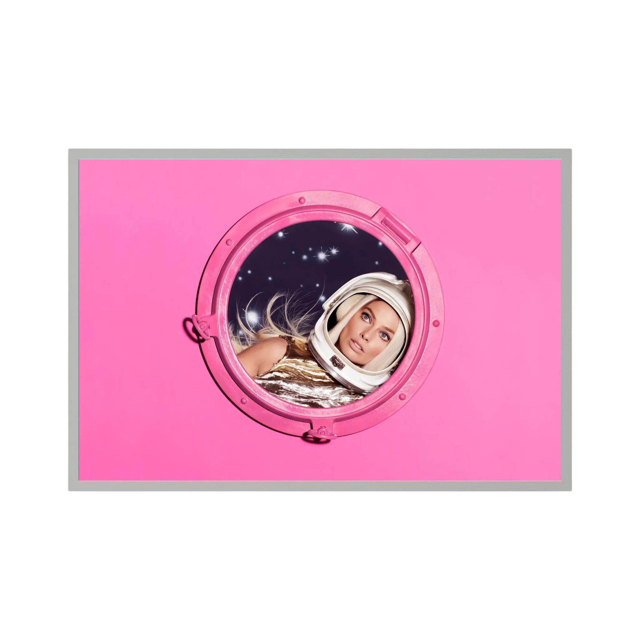 Woman in a metallic astronaut suit looks through a circular porthole set in a vivid pink field, shown in product view 3.