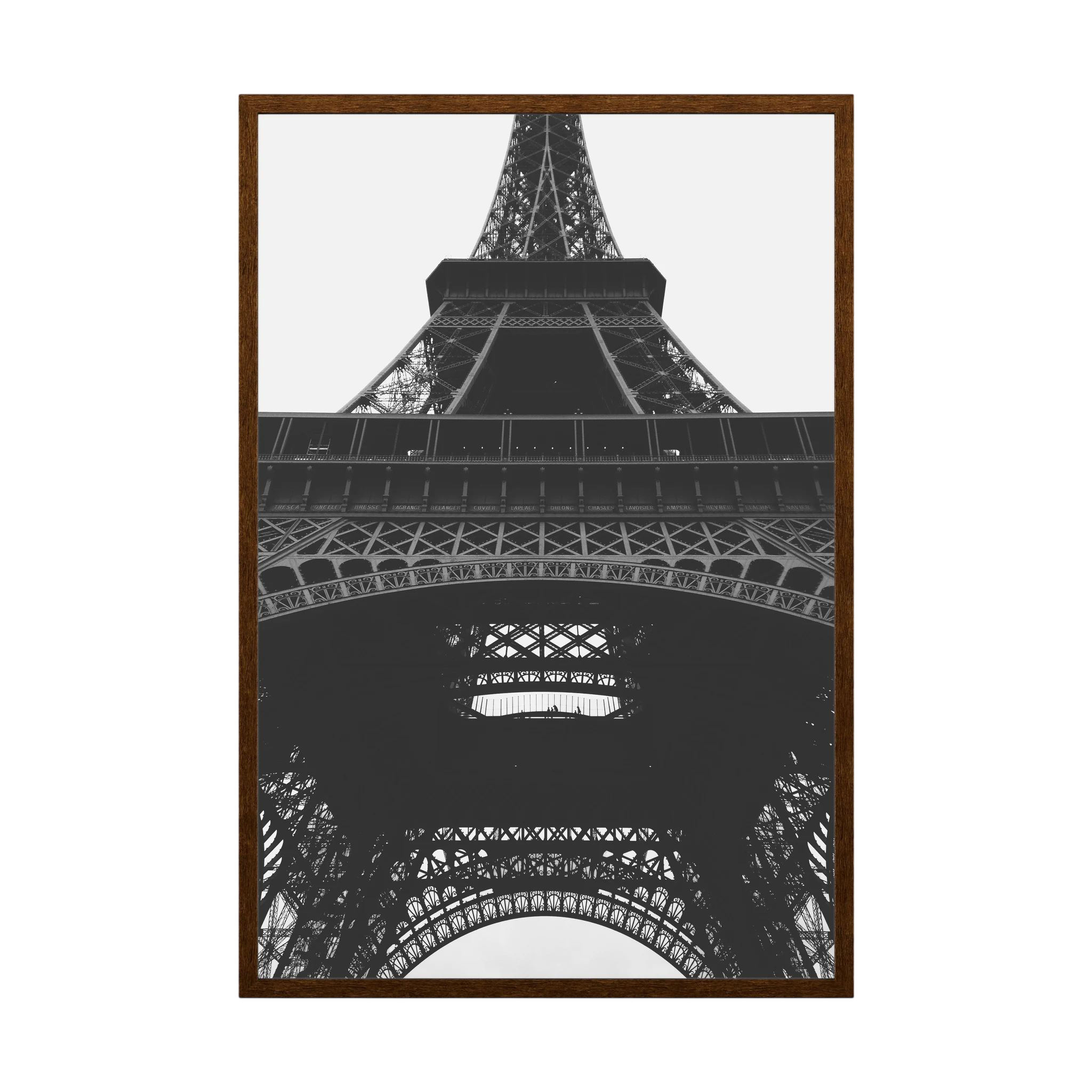 Black and white view looking upward through the iron structure of the Eiffel Tower.
