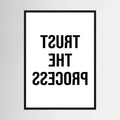 Black mirrored typography spells trust the process backwards against a clean white background, shown in product view 4.