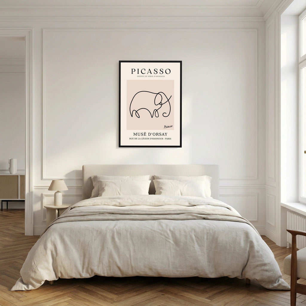 Single flowing black line forms an elephant on a warm beige museum-style poster, shown in product view 8.