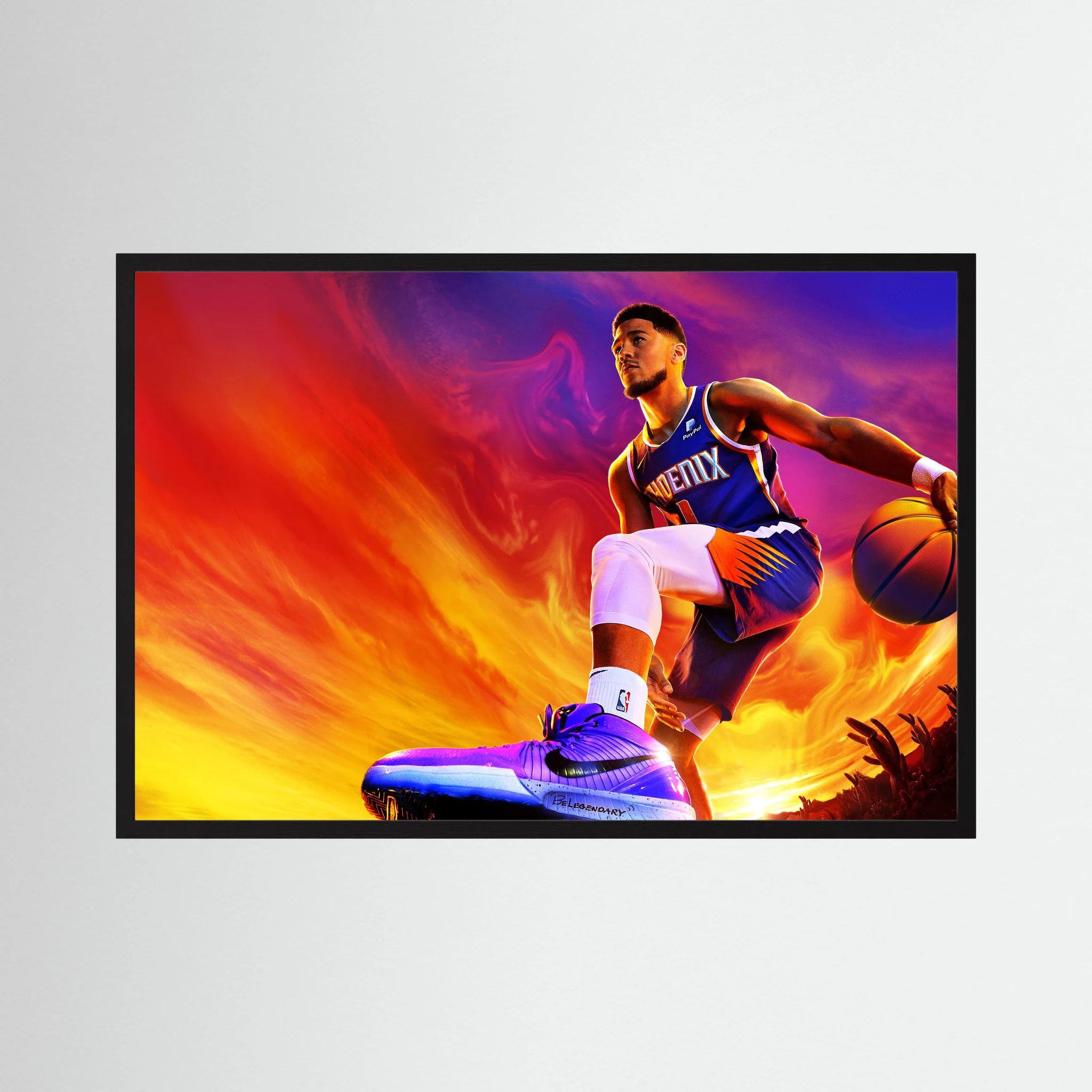 Devin Booker drives with a basketball against an intense orange, purple and blue background, shown in product view 2.