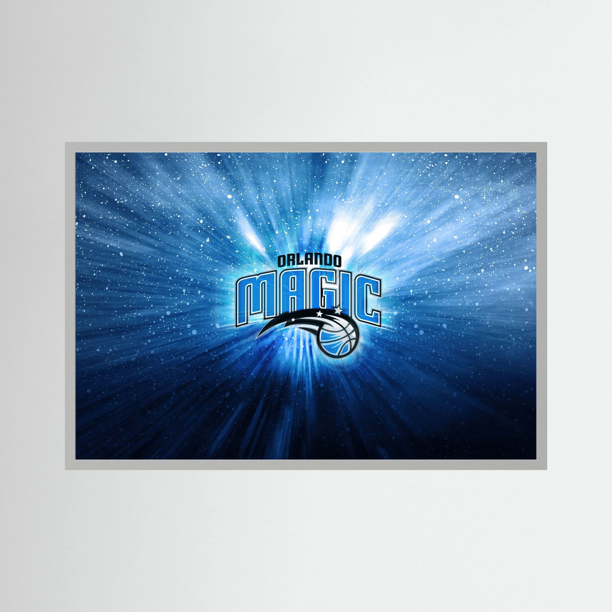 Orlando Magic basketball logo glows amid blue radial light and sparkling white particles.
